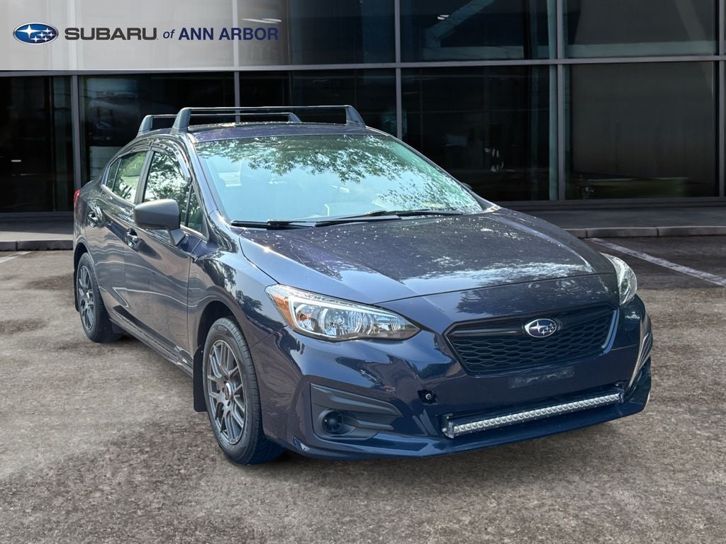 2019 Subaru Impreza 2.0i in Dark Blue Pearl — front three-quarter view