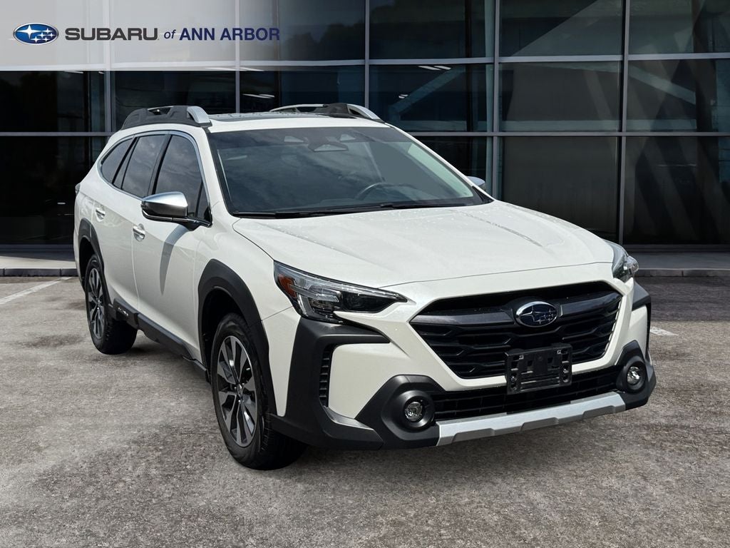 2024 Subaru Outback Touring XT **LIFETIME POWERTRAIN** in Crystal White Pearl — front three-quarter view