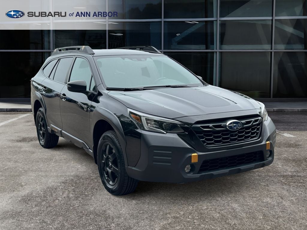 2023 Subaru Outback Wilderness in Crystal Black Silica — front three-quarter view