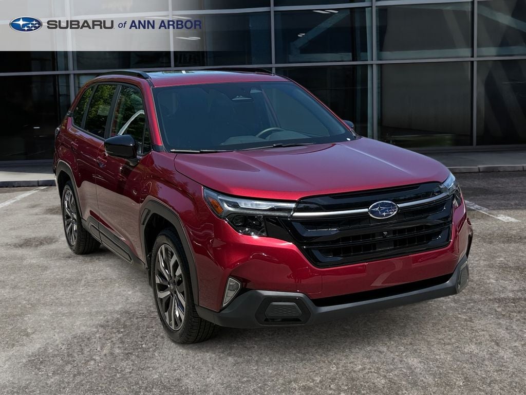 2026 Subaru Forester Touring **LIFETIME POWERTRAIN** in Crimson Red Pearl — front three-quarter view