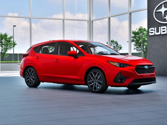 2026 Subaru IMPREZA Sport in Pure Red — front three-quarter view