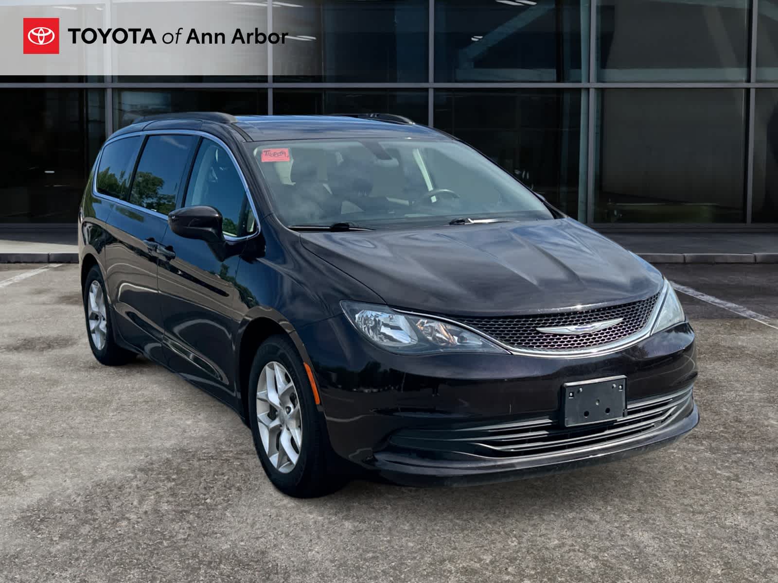 2018 Chrysler Pacifica Touring in Dark Cordovan Pearlcoat — front three-quarter view