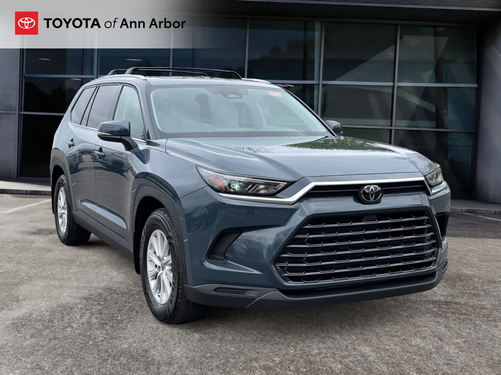 2024 Toyota Grand Highlander XLE in Storm Cloud — front three-quarter view